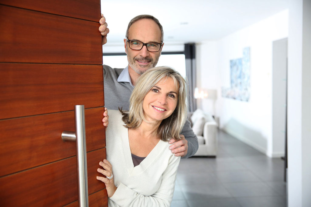 bigstock-Senior-couple-welcoming-people-54882905 - SUSAN CLARK INTERIORS